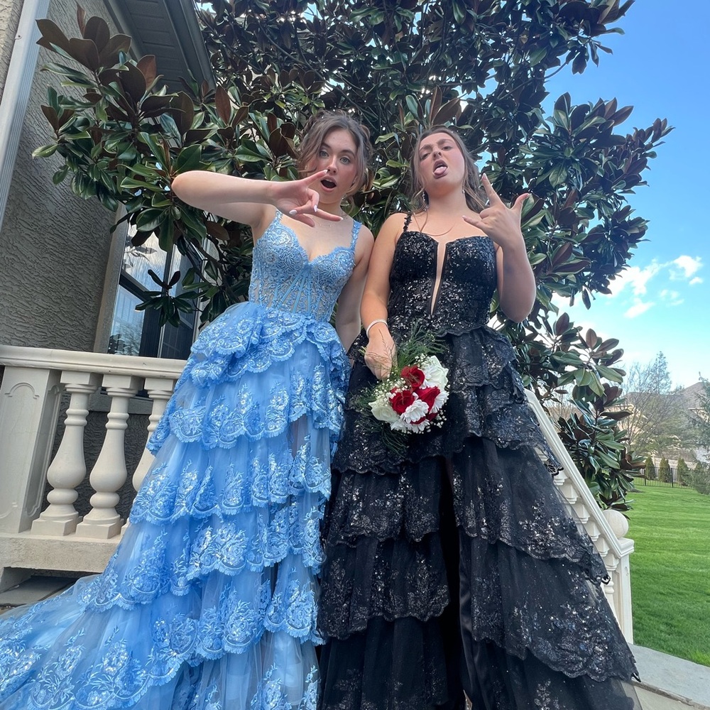 Elegant black prom dress with sequins and a slit